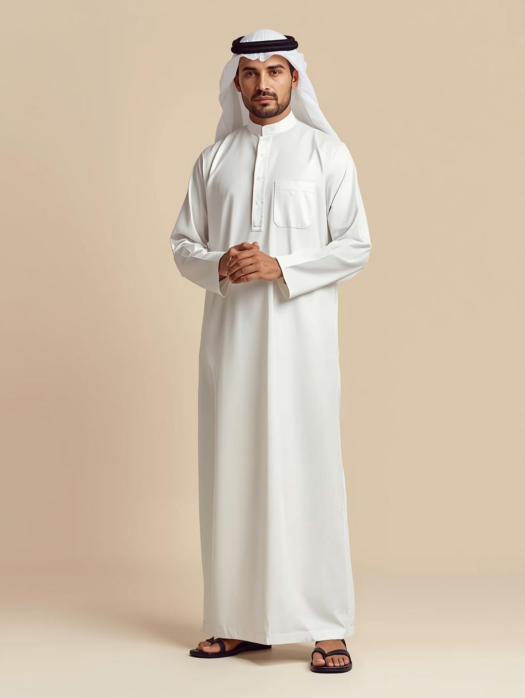 adult man wearing a traditional arabian jubba, luxury fashion style, studio photo, soft cream or beige background, elegant pose, high quality professional lighting, 1000 1500 px, minimal props, clean and premium